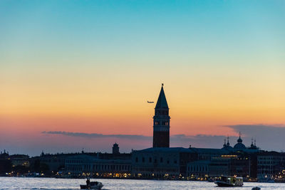 Plane fly close to il campanile in venice 