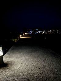 Illuminated city against sky at night