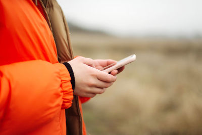 Young woman using smart phone outdoor