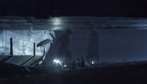 People in illuminated room at night