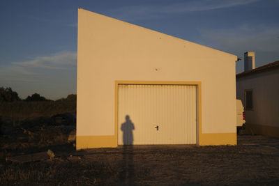 House on field against sky