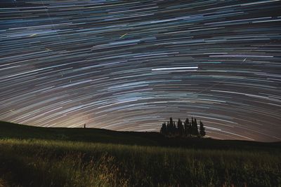 Scenic view of field against sky at night