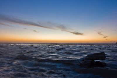 Scenic view of sea at sunset