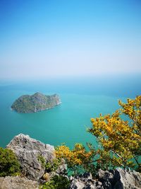 Scenic view of sea against clear blue sky