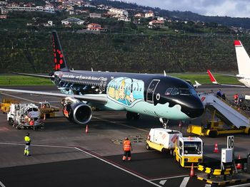 High angle view of airplane on airport runway