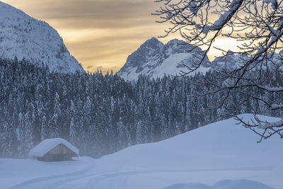 Scenic view of snow covered mountains against sky