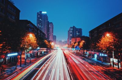 Light trails on city street at night