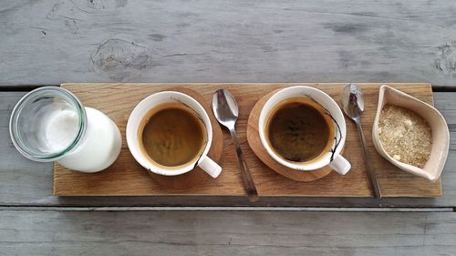 Directly above shot of coffee with milk and brown sugar