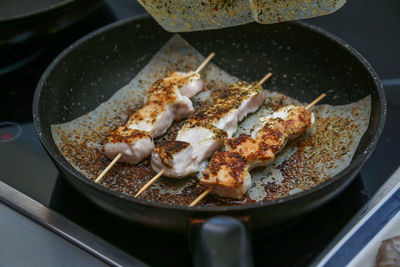 High angle view of meat in cooking pan