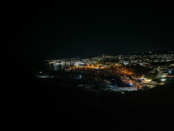 High angle view of illuminated buildings in city at night