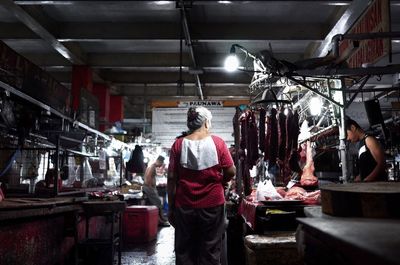 Rear view of woman in munoz market