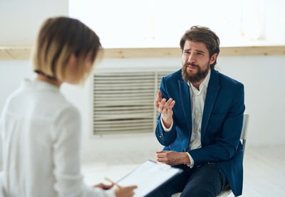 Side view of businessman working at office