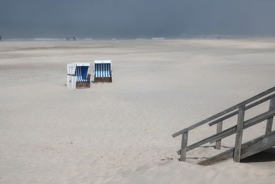 Hooded chairs on beach, sylt