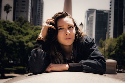 Beautiful young woman in city