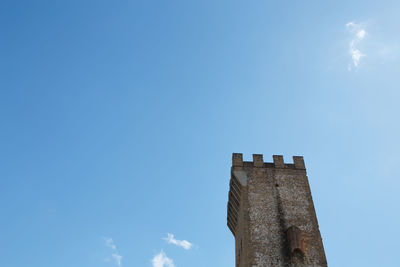 Low angle view of building against blue sky