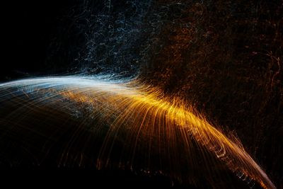 Light trails against sky at night