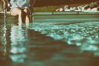 Low section of man in swimming pool