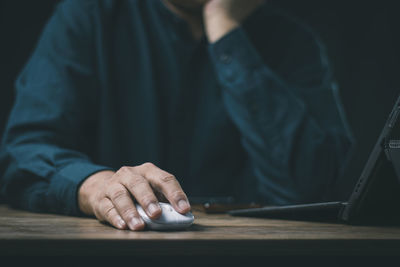 Men are using computer for social media and online marketing including working from home. 