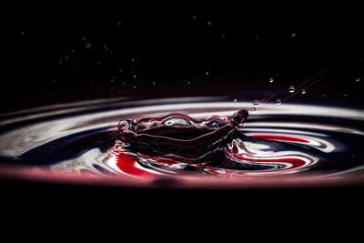 Close-up of water splashing against black background