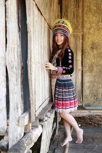 Portrait of a smiling young woman standing outdoors