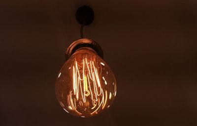 Low angle view of illuminated light bulb