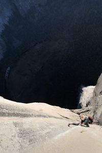 Rock climber crack climbing on the nose, el capitan in yosemite