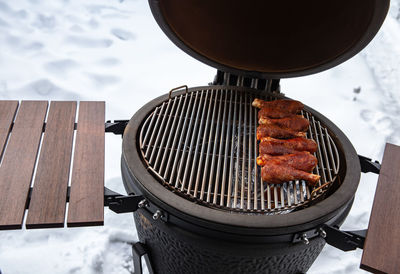 High angle view of meat on barbecue grill