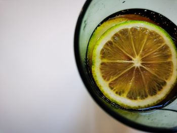 Directly above shot of drink in glass against white background