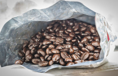 Close-up of coffee beans on table