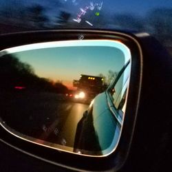 Close-up of side-view mirror of car