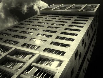 Low angle view of building against cloudy sky