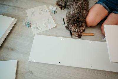 High angle view of woman sitting on table