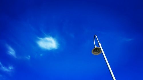 Low angle view of communications tower against sky