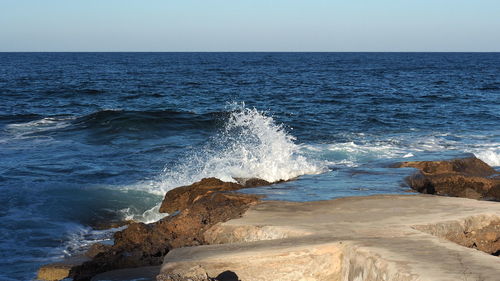 Scenic view of sea against clear sky