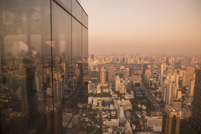 High angle view of modern buildings in city against sky