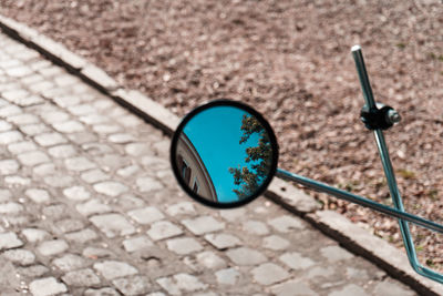 High angle view of sunglasses on footpath