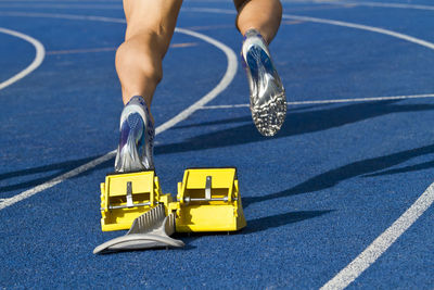 Low section of person on sports track