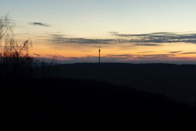 Scenic view of silhouette landscape against sky during sunset