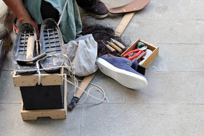 Low section of man sitting on book