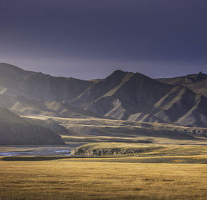 Scenic view of landscape and mountains against sky