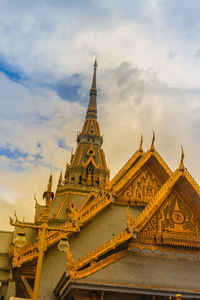 Low angle view of temple building against cloudy sky