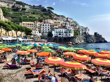 High angle view of people at beach against buildings