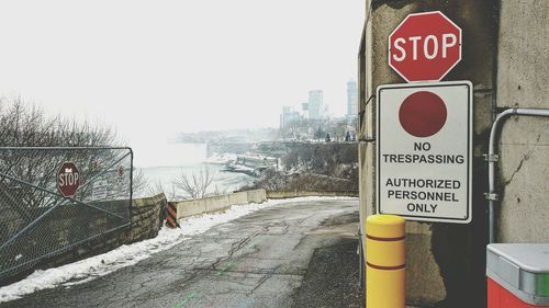 Close-up of road sign against clear sky