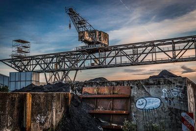 Old metal structure against sky