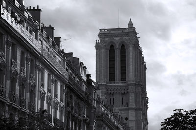 Low angle view of historical building against cloudy sky