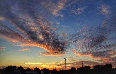 Low angle view of cloudy sky at sunset