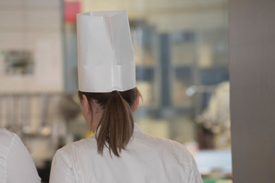 Rear view of woman wearing hat