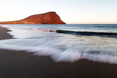 Scenic view of beach against sky