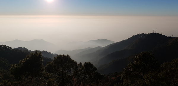 Scenic view of mountains against sky during sunset