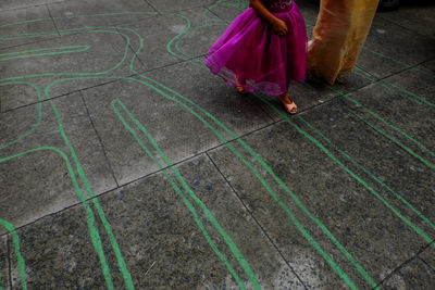 Low section of woman dress walking